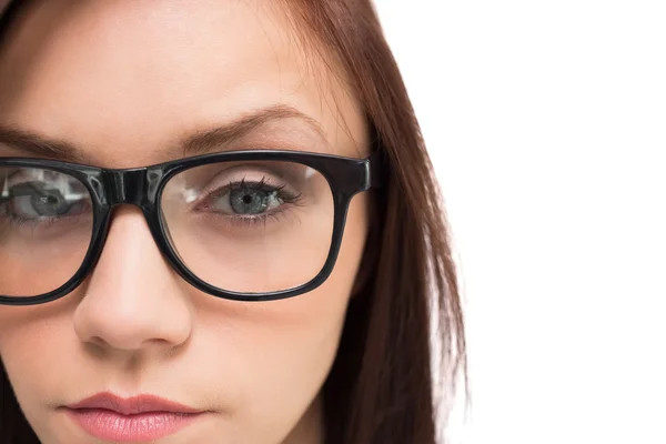 Close up on serious brunette with glasses posing — Stock Photo, Image