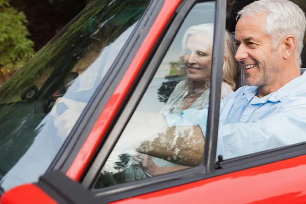 Happy mature man having a ride with his wife — Stock Photo, Image