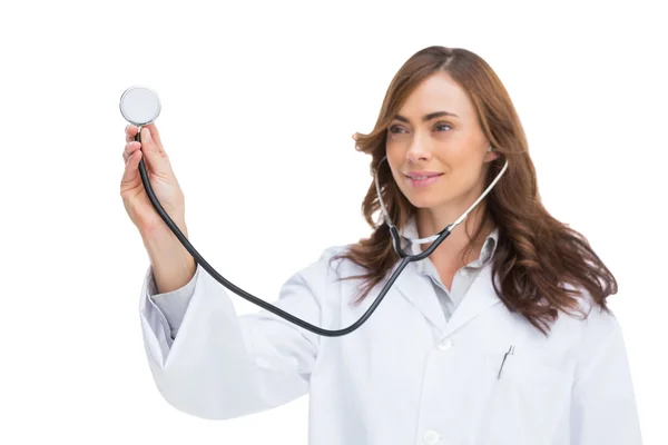 Smiling doctor holding stethoscope — Stock Photo, Image