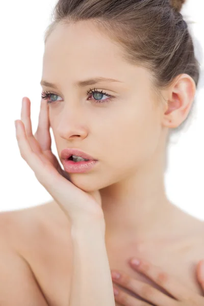 Thoughtful brunette model posing holding her head — Stock Photo, Image