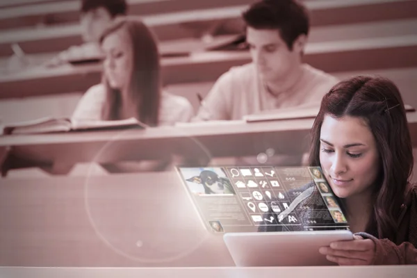 Concentrated student working on her futuristic tablet — Stock Photo, Image