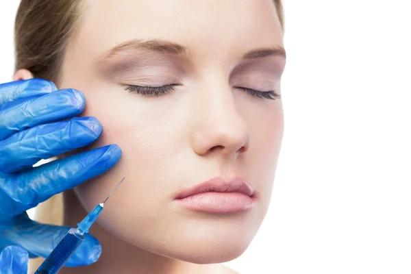 Relaxed cute model having botox injection on the cheek — Stock Photo, Image