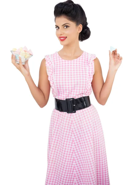 Pleased black hair model holding candies — Stock Photo, Image