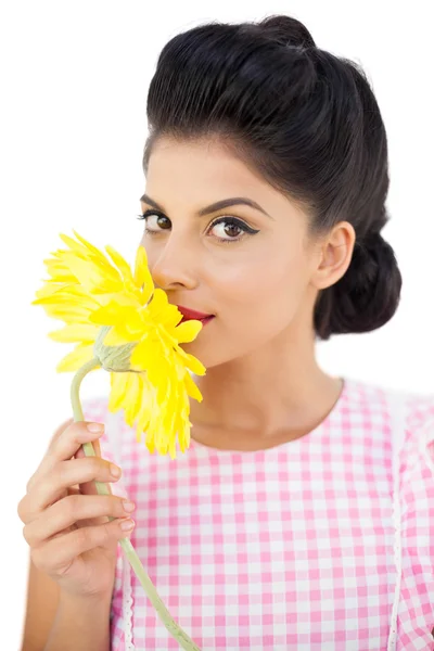 Seductive black hair model smelling a flower — Stock Photo, Image