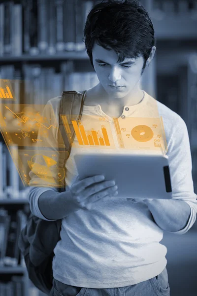 Concentrated handsome student working on his futuristic tablet — Stock Photo, Image