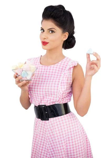 Content black hair model holding candies — Stock Photo, Image