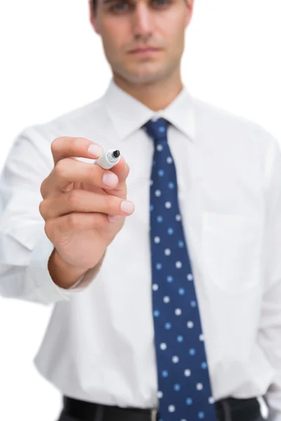 Close up on businessman holding marker Stock Picture