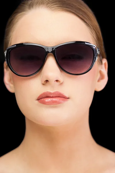 Classy blonde model wearing sunglasses Royalty Free Stock Photos