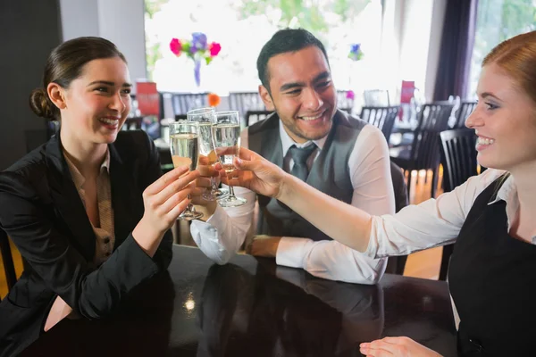 Three business people toasting their success — Stock Photo, Image