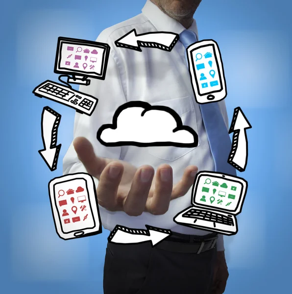 Elegante hombre de negocios sosteniendo dibujos de computación en nube —  Fotos de Stock