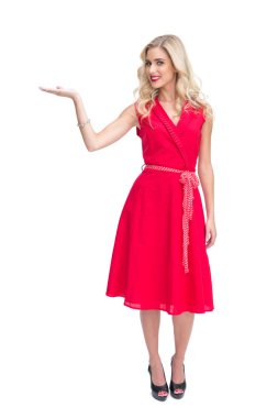 Cheerful woman in red dress presenting something in her hand clipart