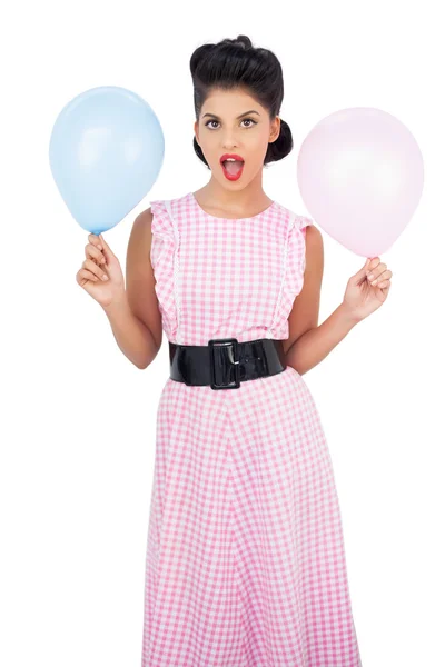 Amused black hair model holding balloons — Stock Photo, Image