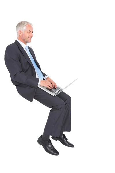 Confident mature businessman working on his laptop — Stock Photo, Image