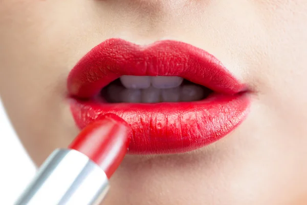 Extreme close up on gorgeous red lips being made up — Stock Photo, Image