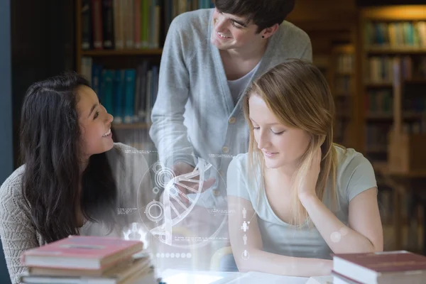 Smiling students working together with futuristic interface — Stock Photo, Image