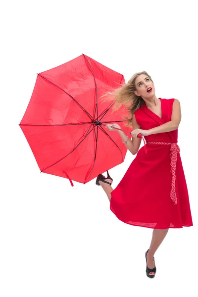 Schöne Frau im roten Kleid mit Regenschirm — Stockfoto