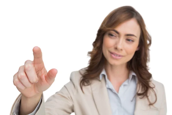 Businesswoman touching invisible screen — Stock Photo, Image