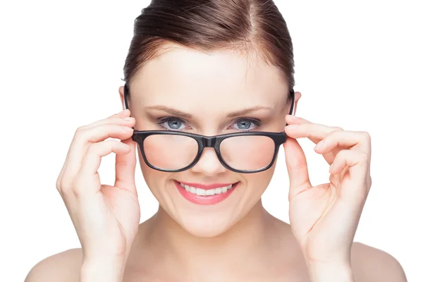 Smiling natural model looking over her classy glasses — Stock Photo, Image