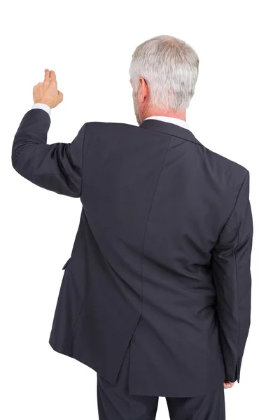 Rear view of stylish mature businessman pointing finger — Stock Photo, Image