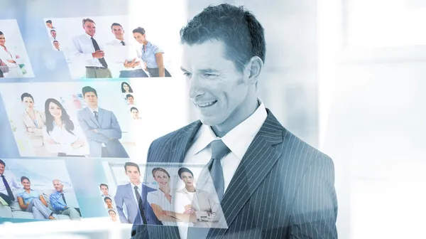 Pleased businessman looking at pictures — Stock Photo, Image