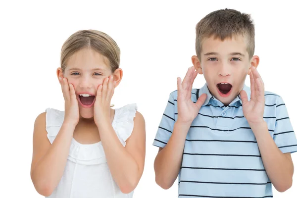 Brother and sister being shocked — Stock Photo, Image