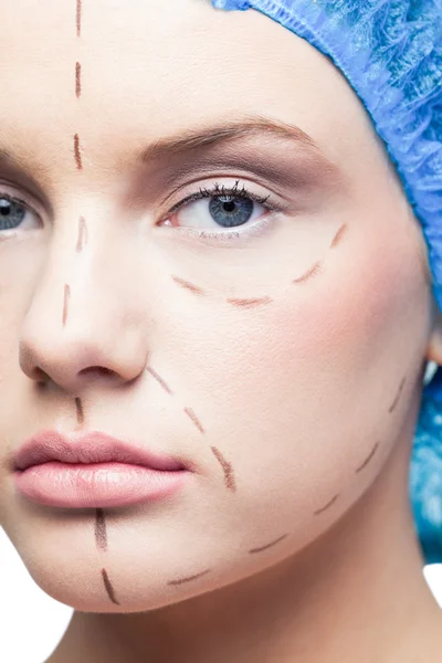 Close up on relaxed young patient with dotted lines on the face — Stock Photo, Image