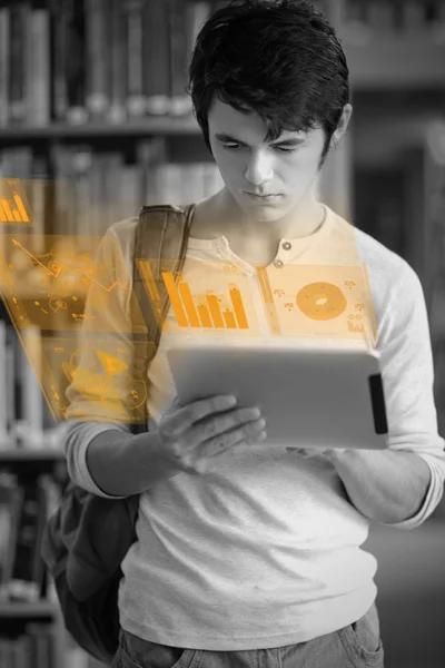 Focused handsome student working on his futuristic tablet — Stock Photo, Image