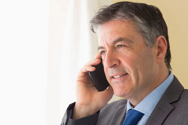 Concentrated man calling someone with his mobile phone — Stock Photo, Image