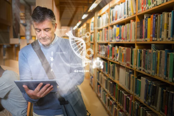 Mature student using futuristic hologram to learn science from his tablet — Stock Photo, Image