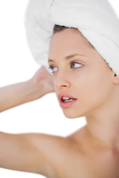 Thoughtful brunette drying her hair looking away — Stock Photo, Image