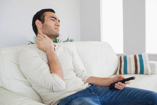 Handsome man suffering from painful neck — Stock Photo, Image