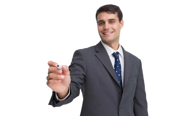 Smiling businessman holding marker and looking at camera — Stock Photo, Image