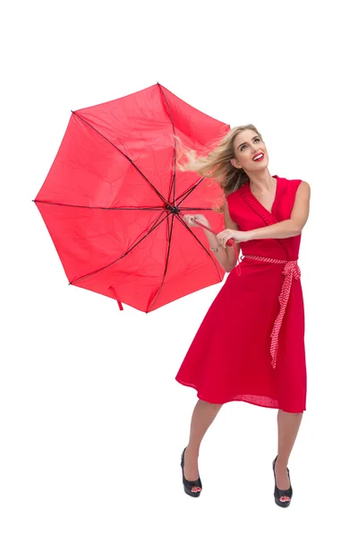 Pretty glamour woman holding a broken umbrella — Stock Photo, Image