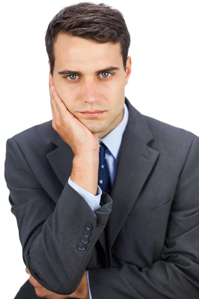 Concentrated businessman looking at camera — Stock Photo, Image