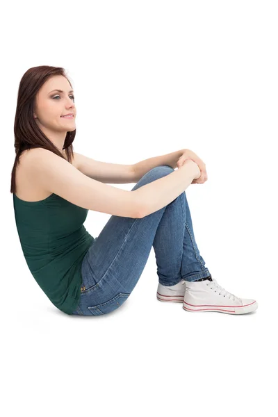 Pensive attractive brunette sitting — Stock Photo, Image