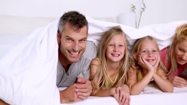 Family playing with duvet — Stock Video