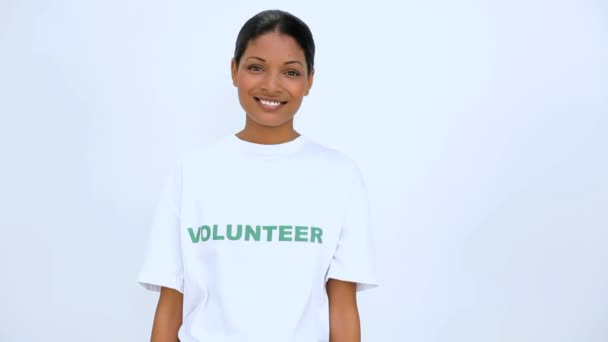 Volunteer woman does sign at camera — Stock Video