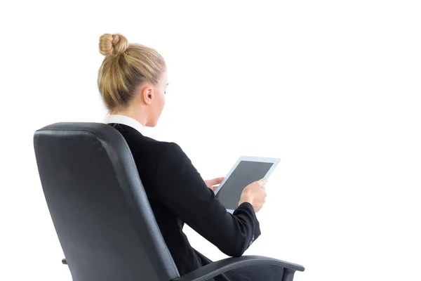 Attractive blonde businesswoman sitting on her office chair — Stock Photo, Image