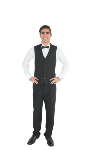Attractive waiter posing with hands on hips — Stock Photo, Image
