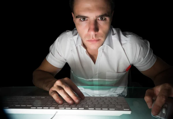 Handsome serious computer engineer working at night — Stock Photo, Image