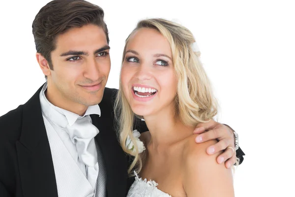 Smiling handsome bridegroom posing with his wife — Stock Photo, Image