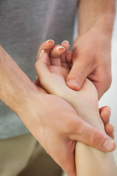 Patients hand being massaged by physiotherapist — Stock Photo, Image