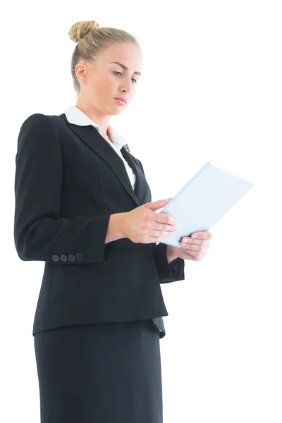 Concentrated young businesswoman working with her tablet — Stock Photo, Image