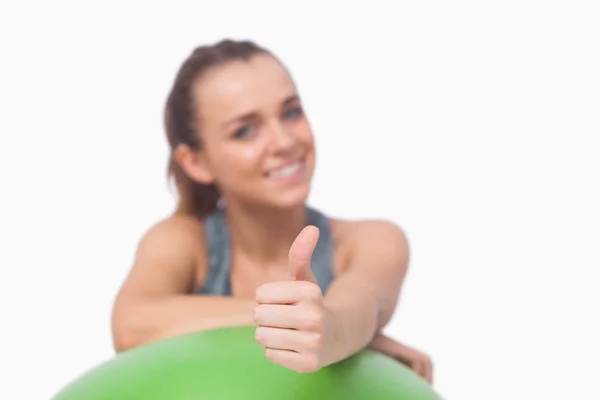 Ponytailed woman showing thumbs up — Stock Photo, Image