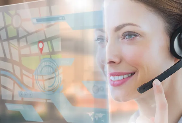 Happy call center employee looking at futuristic interface hologram — Stock Photo, Image