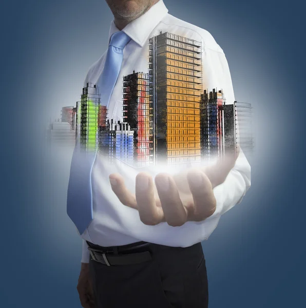 Close up of hand showing colored holographic city — Stock Photo, Image