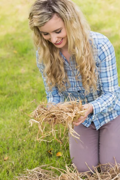 Smiling blonde feeling yellow straw — Stock Photo, Image