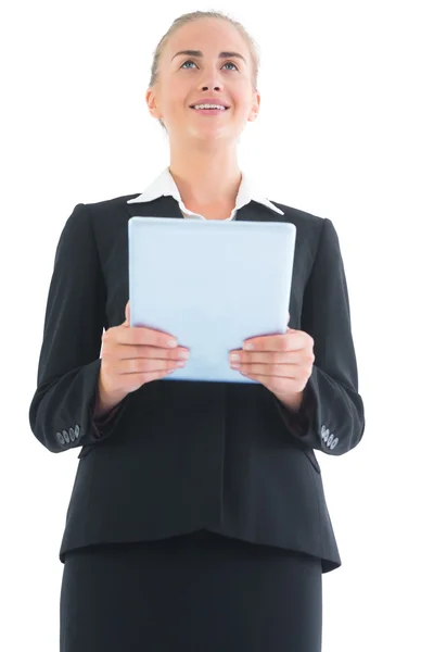 Low angle front view of beautiful young businesswoman holding her blue tablet — Stock Photo, Image