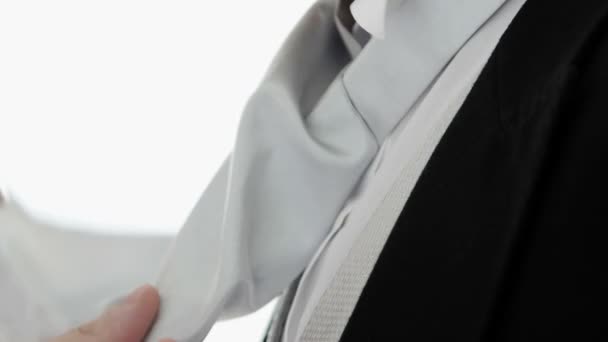 Handsome groom getting his tie bonded — Stock Video