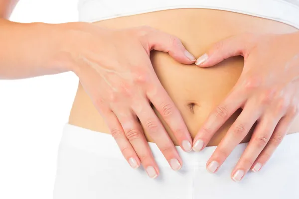 Close up picture of fit woman holding her belly — Stock Photo, Image